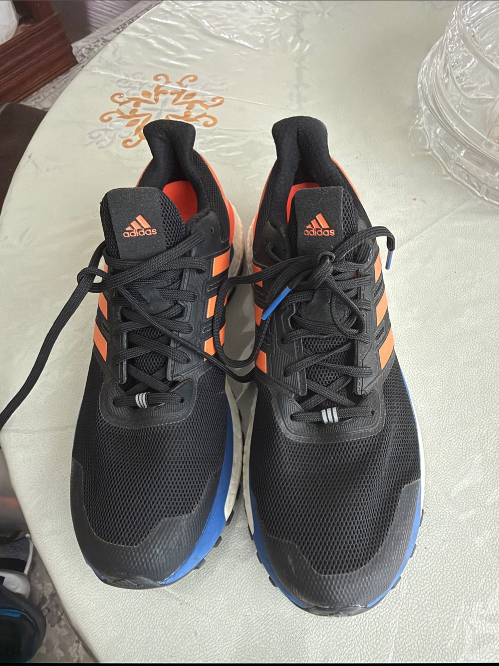 adidas Men’s Black Shoes with Orange Stripes and Blue Soles